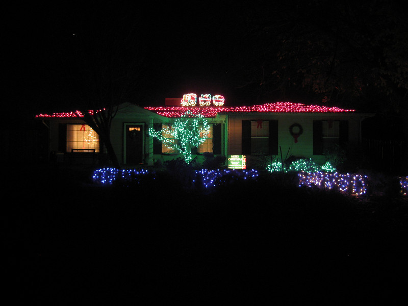 house with red christmas lights